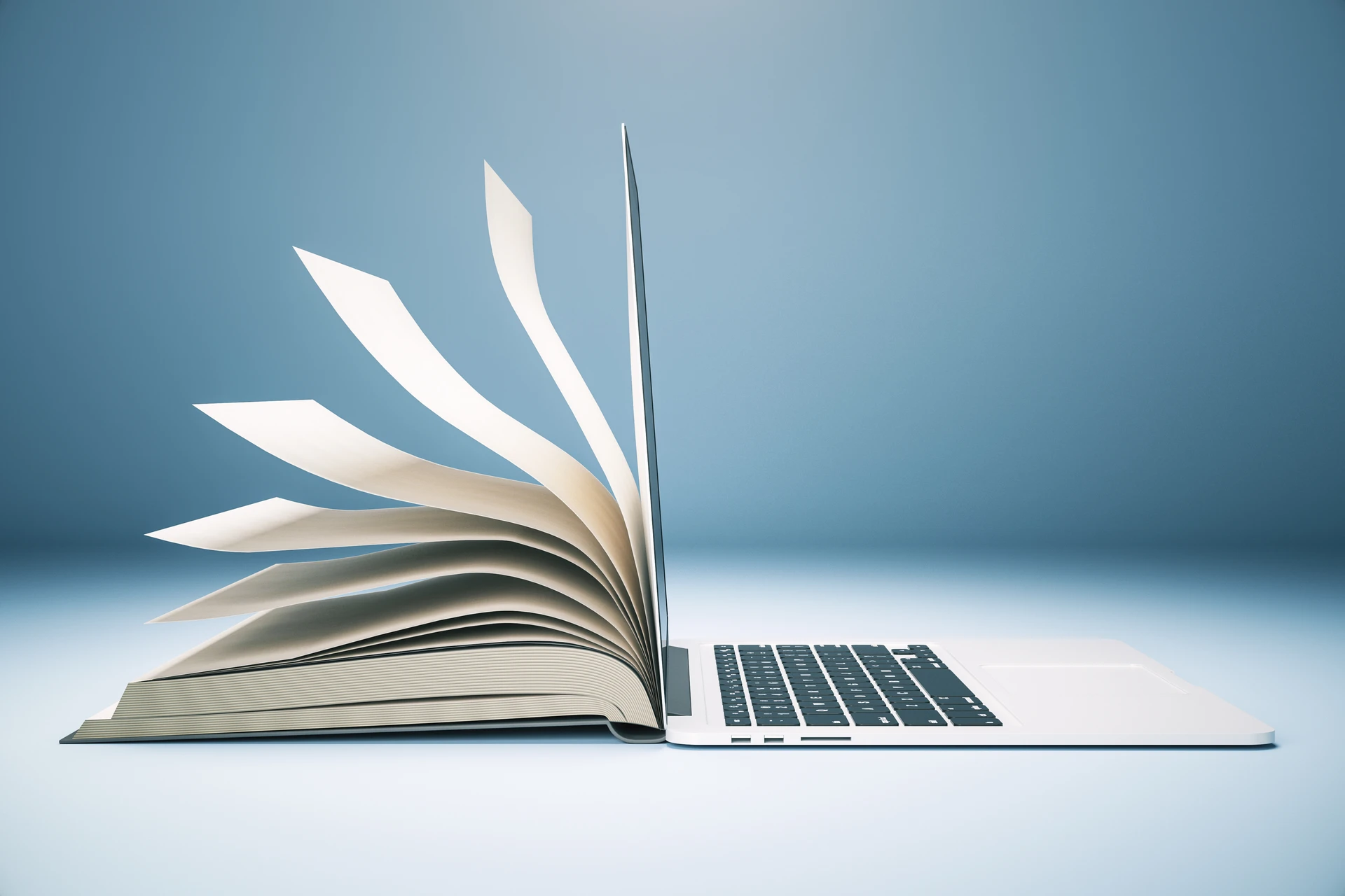 Laptop z otwartymi stronami książki symbolizujący system bazy wiedzy AI do centralizacji danych w firmie.